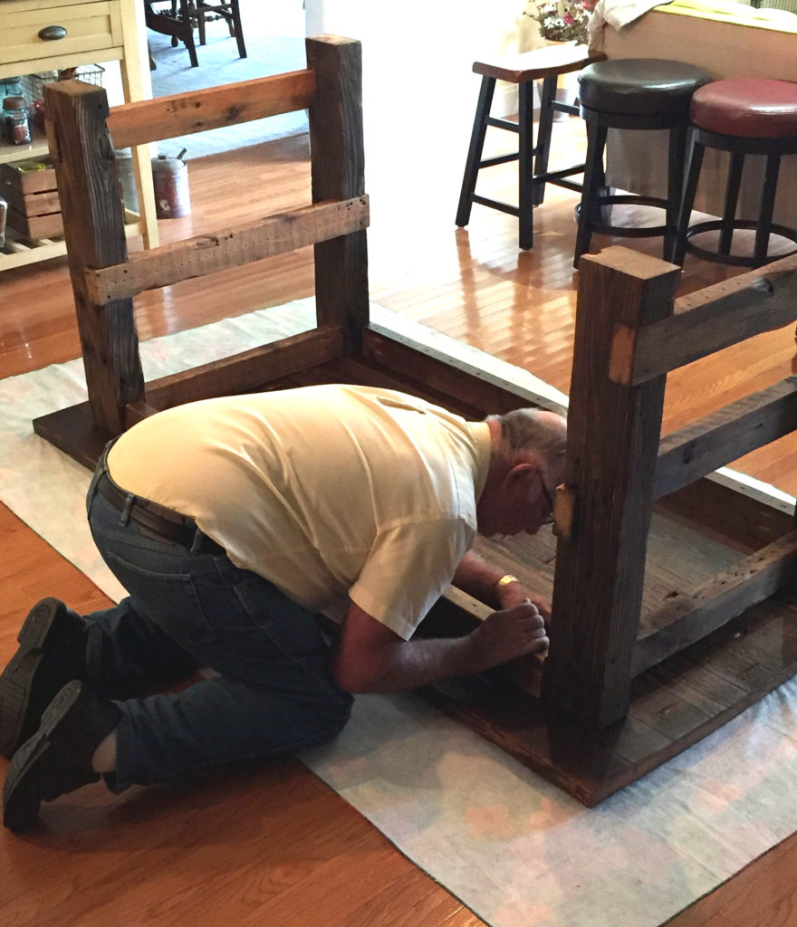 Dad putting together farmhouse table
